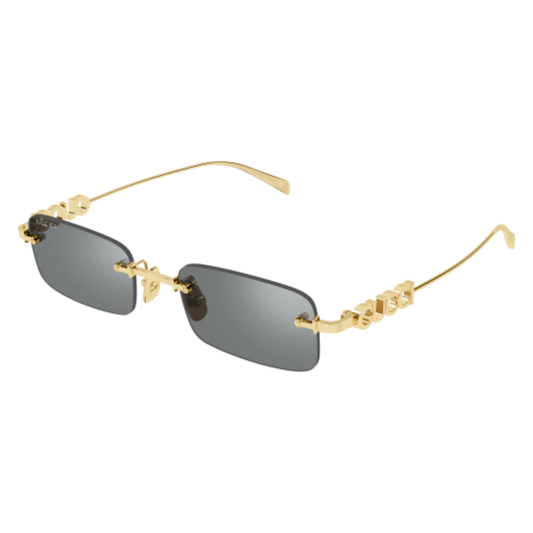 Gold-framed sunglasses with dark lenses on a white background