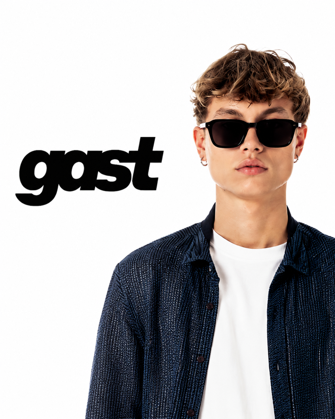 Gast Eyewear campaign featuring a model wearing black square sunglasses in a clean minimalist studio setting.