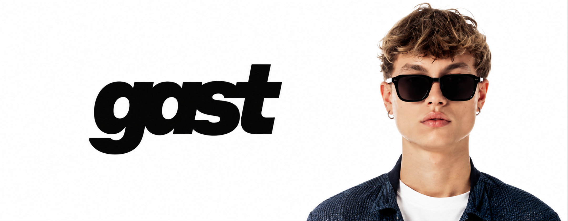 Gast Eyewear campaign featuring a model wearing black square sunglasses in a clean minimalist studio setting.