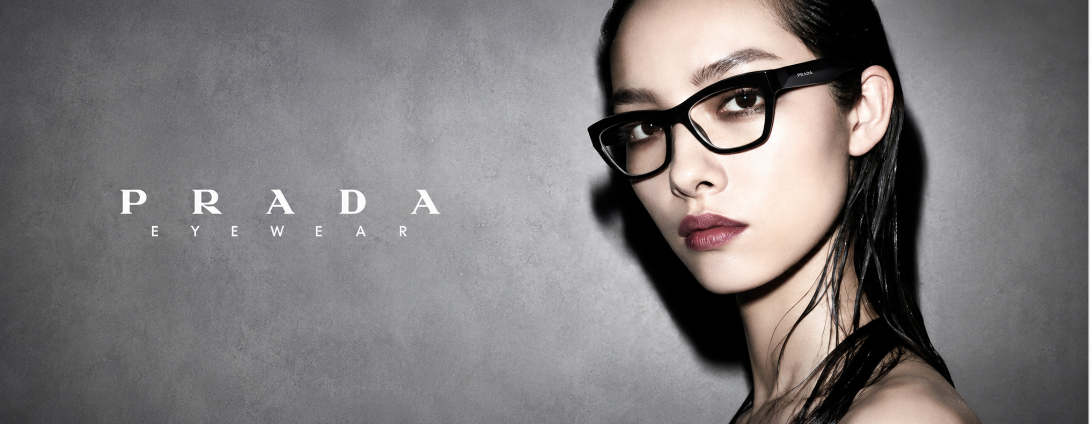 Prada Eyewear black cat-eye designer optical glasses for women featuring a premium luxury acetate frame with modern Italian fashion styling.